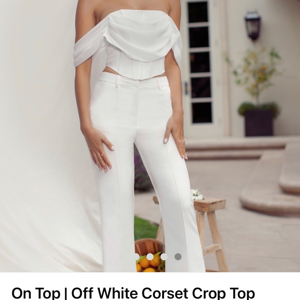 Club L London off white corset crop top with draped off the shoulders sleeves.